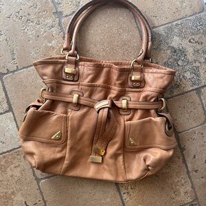 B. Makowsky tan bag
